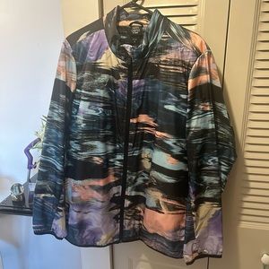 Torrid Multi Color Nylon Jacket Which Zips Up Front And has 2 Side Pockets.